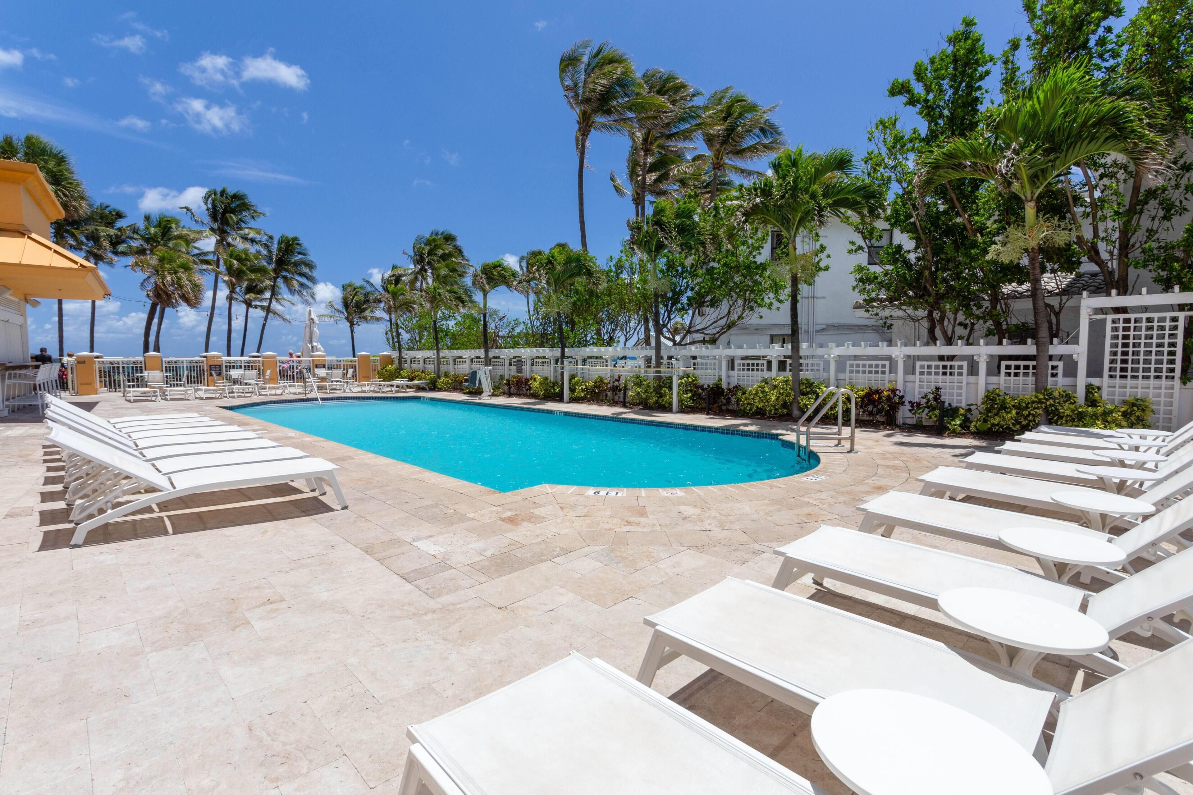 Outdoor pool, a heated pool, cabanas (surcharge), sun loungers