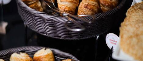 A display of pastries in wicker baskets.