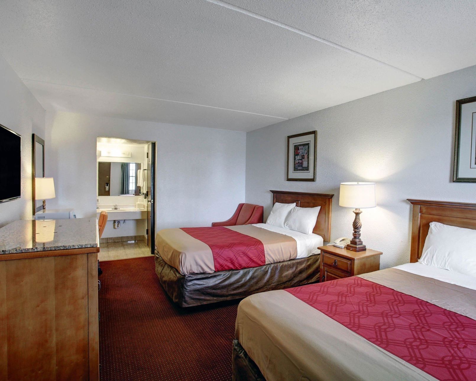 Desk, blackout drapes, iron/ironing board, rollaway beds