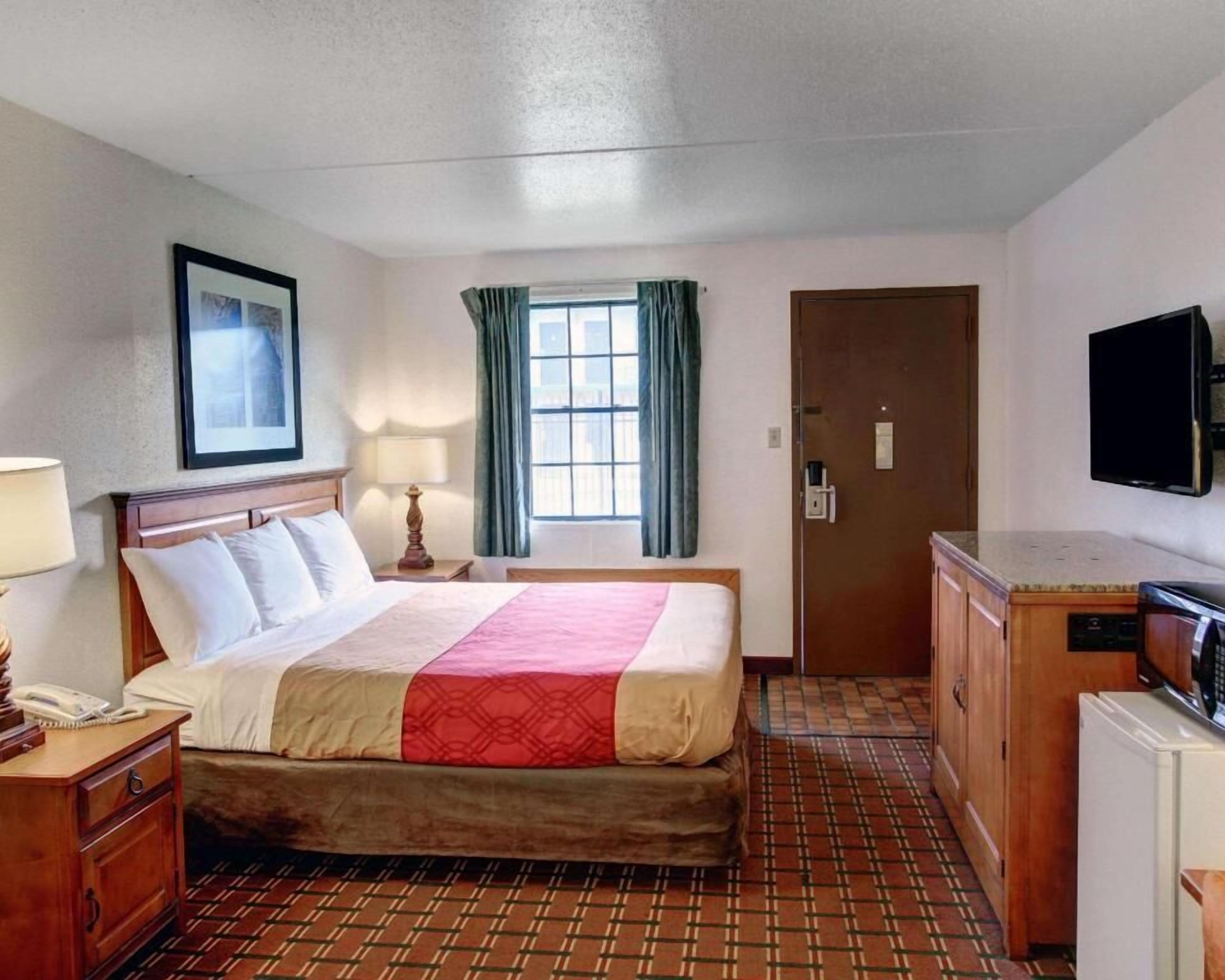 Desk, blackout drapes, iron/ironing board, rollaway beds