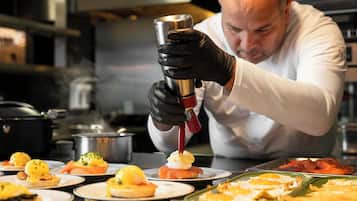 A chef preparing food in a kitchen.