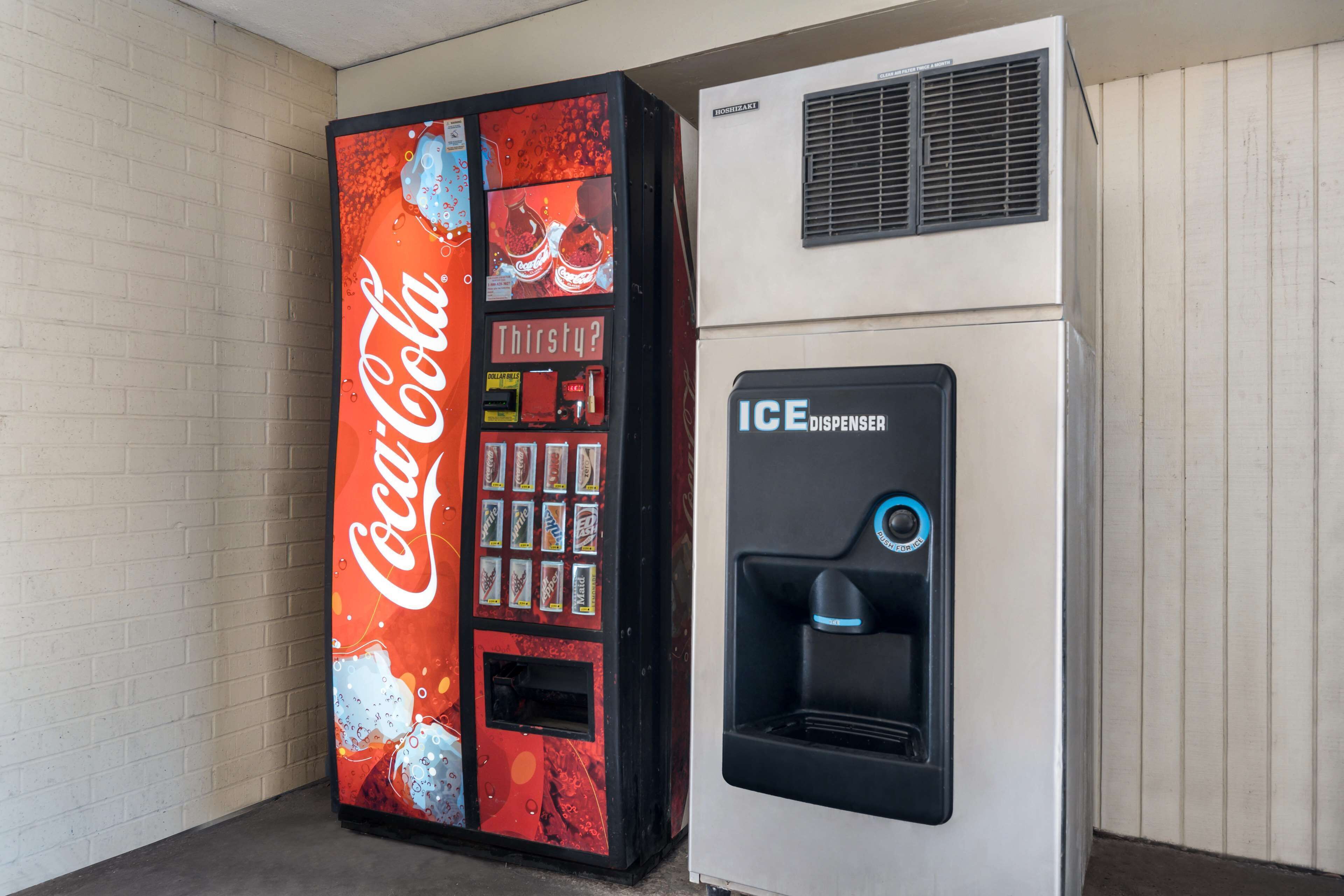 A Coca-Cola vending machine and an ICE dispenser.