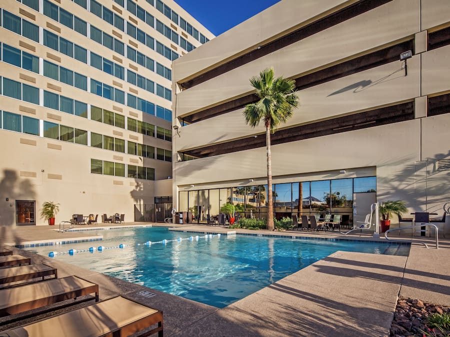 Outdoor pool, open 6:00 AM to 10:00 PM, sun loungers