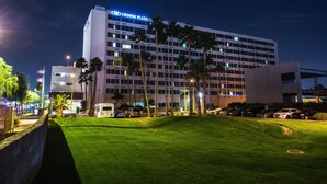 A hotel with a flat roof, multiple floors, and a sign reading "CROWNE PLAZA". - Crowne Plaza Phoenix Airport - PHX by IHG (Phoenix)