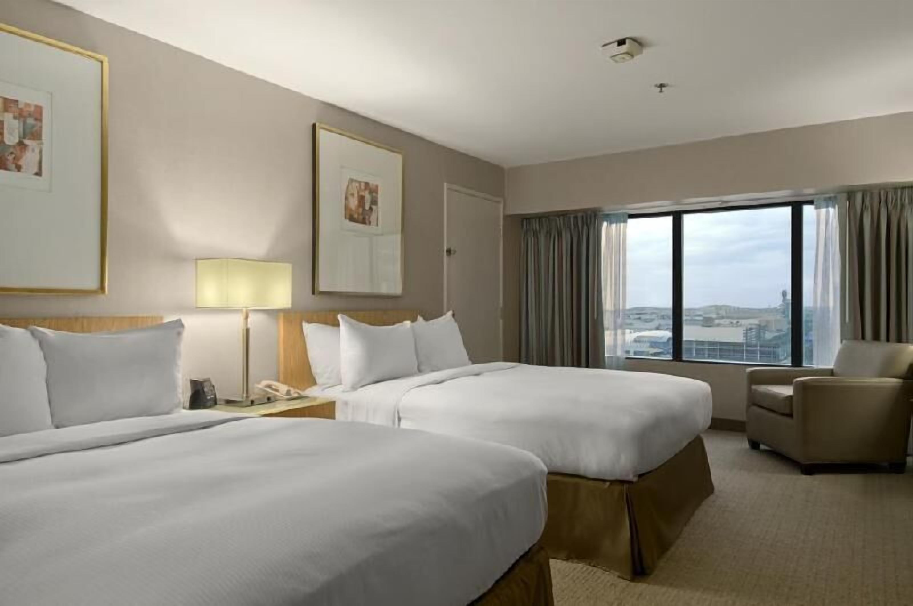Premium bedding, pillow-top beds, in-room safe, desk