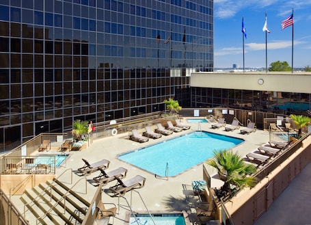 Outdoor pool, open 6:00 AM to 10:00 PM, sun loungers