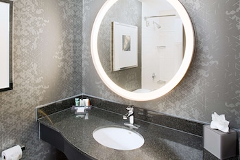 Shower, designer toiletries, hair dryer, towels at Hilton Boston Back Bay
