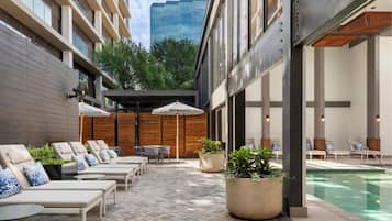 Indoor pool, open 7:00 AM to 10:00 PM, pool umbrellas, pool loungers