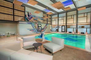 Indoor pool, pool umbrellas, sun loungers