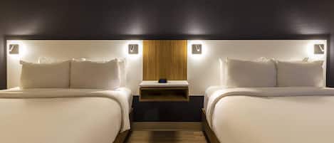 Premium bedding, pillow-top beds, desk, laptop workspace