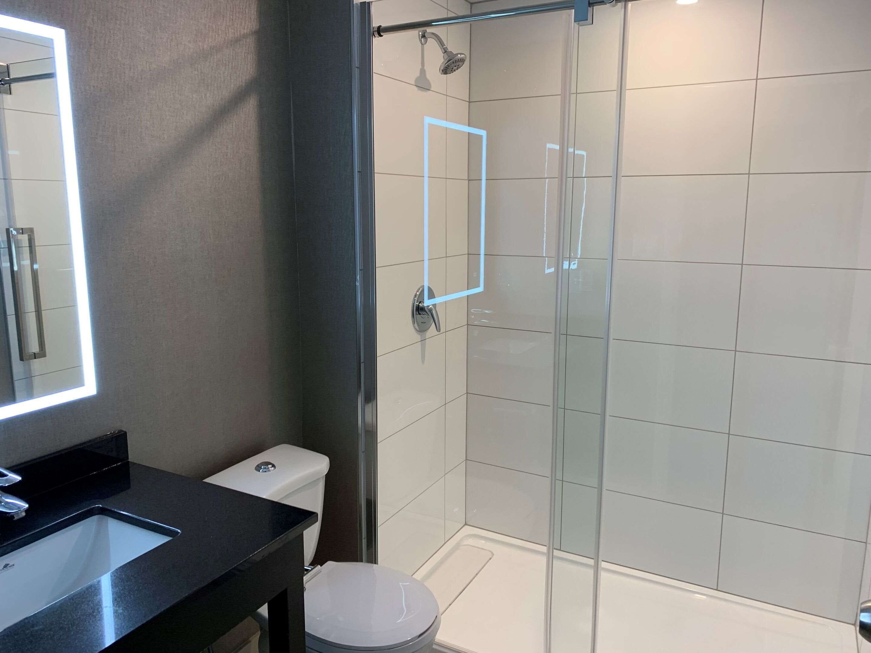 premium bedding, pillow-top beds, desk, laptop workspace