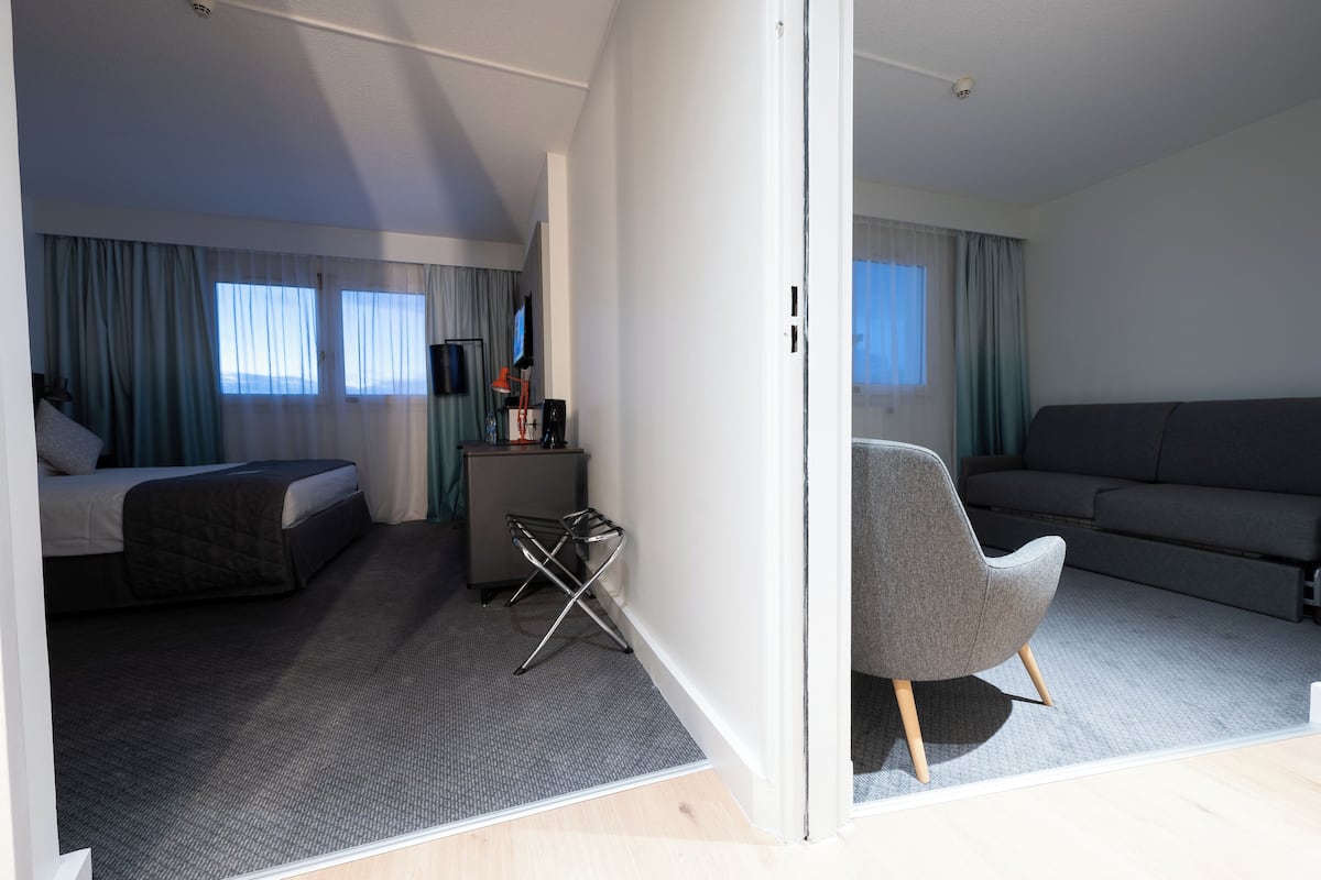 Suite, 1 Queen Bed, City View | Minibar, desk, blackout drapes, iron/ironing board