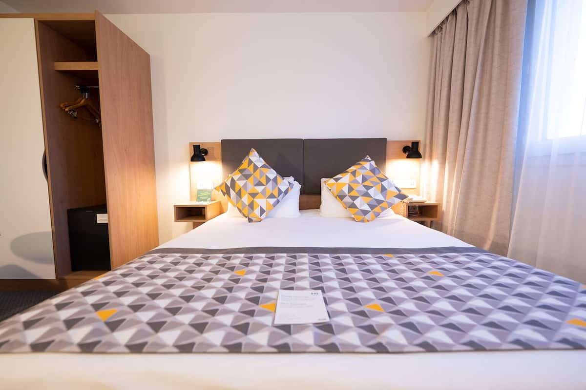 Minibar, desk, blackout curtains, iron/ironing board