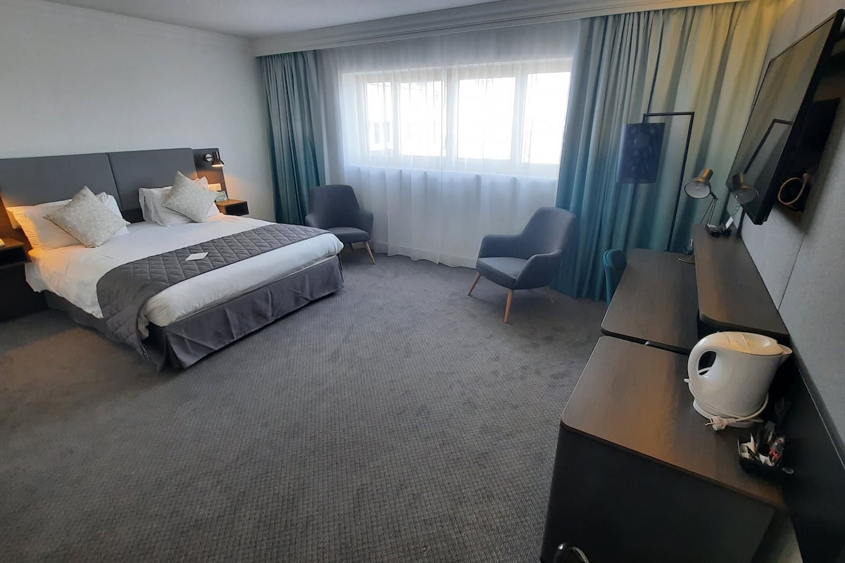 Minibar, desk, blackout curtains, iron/ironing board