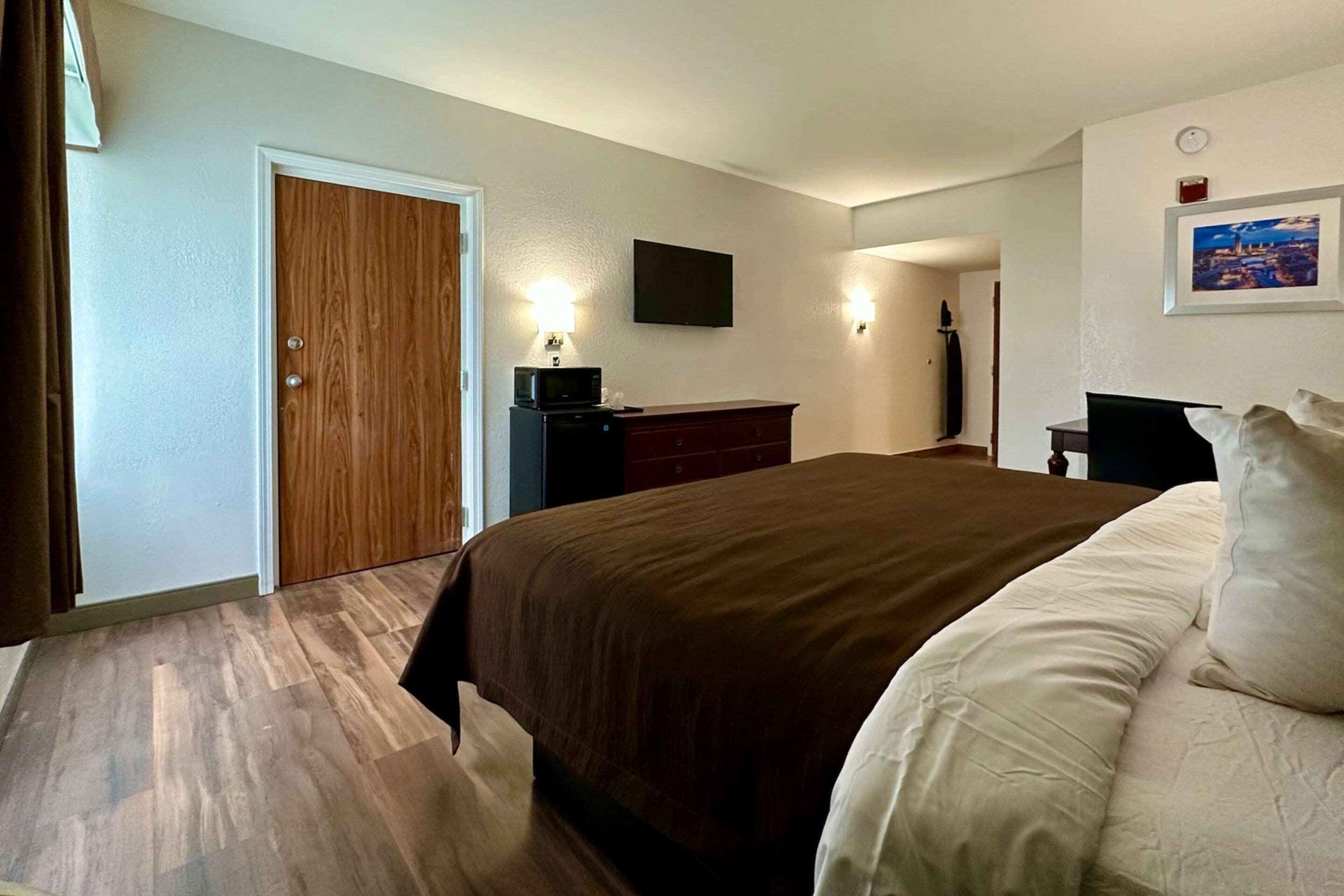 desk, laptop workspace, blackout curtains, iron/ironing board