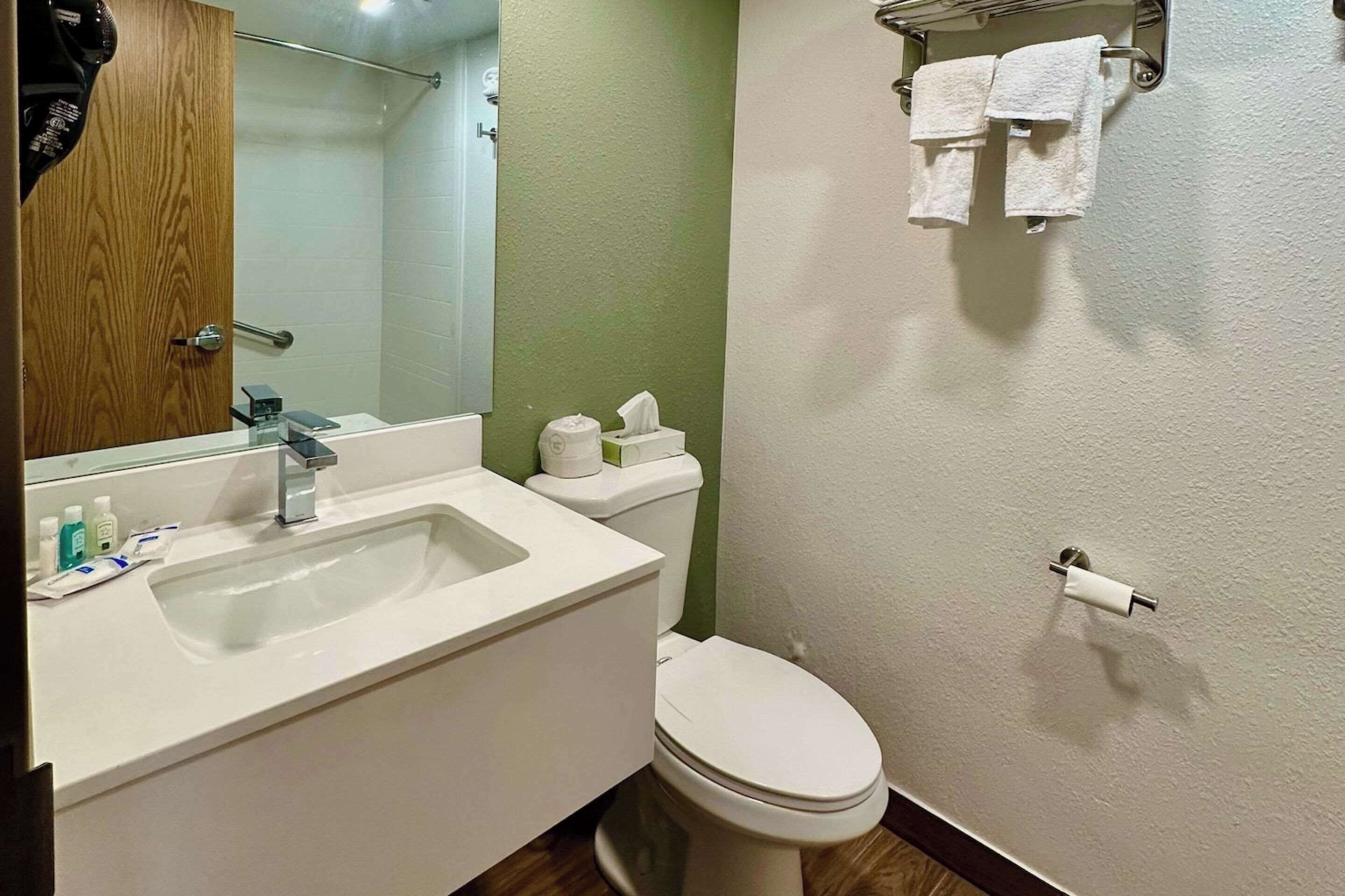 desk, laptop workspace, blackout curtains, iron/ironing board