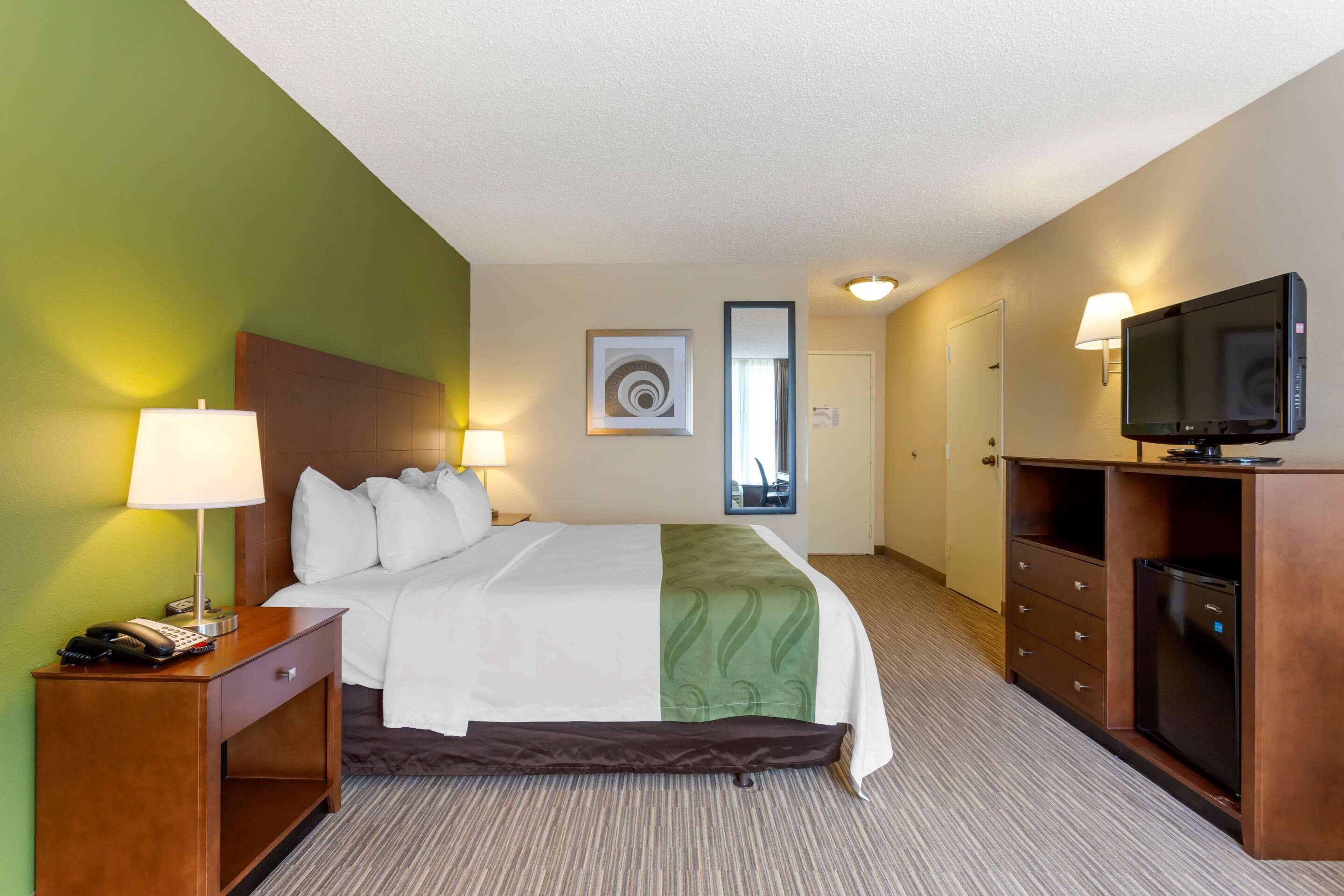 premium bedding, desk, blackout curtains, iron/ironing board