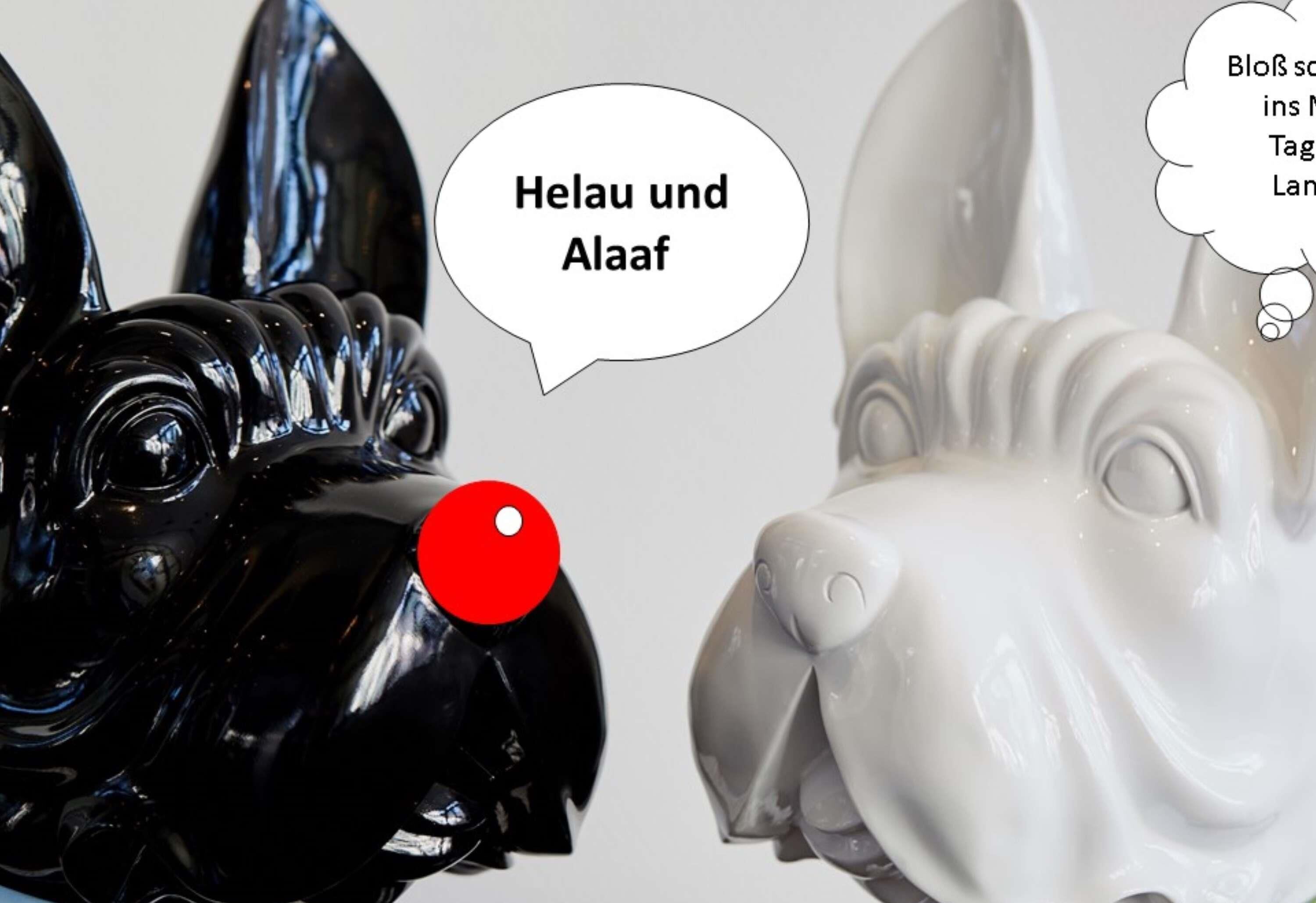 Two ceramic dog figurines with speech bubbles.