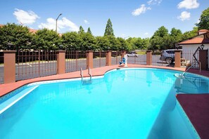 Seasonal outdoor pool, open 9:00 AM to 9:00 PM, pool umbrellas