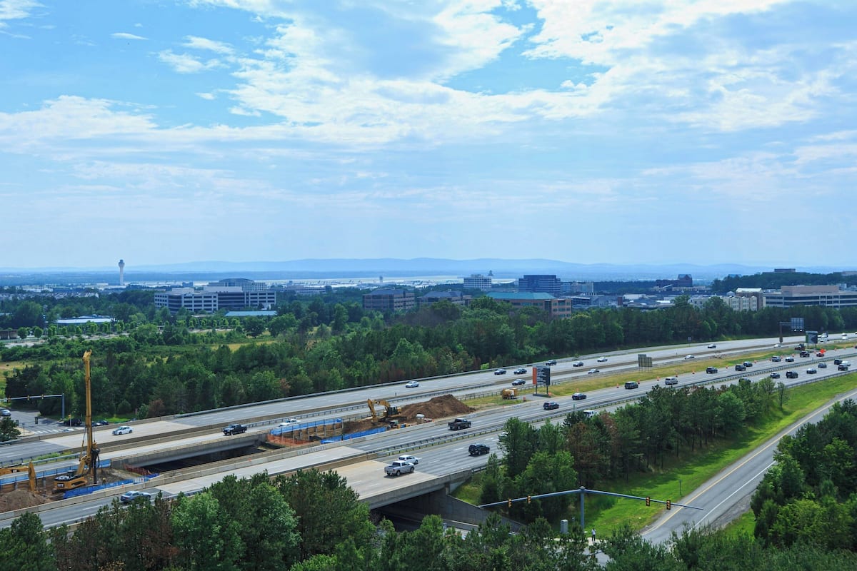 A highway with multiple lanes and construction work.
