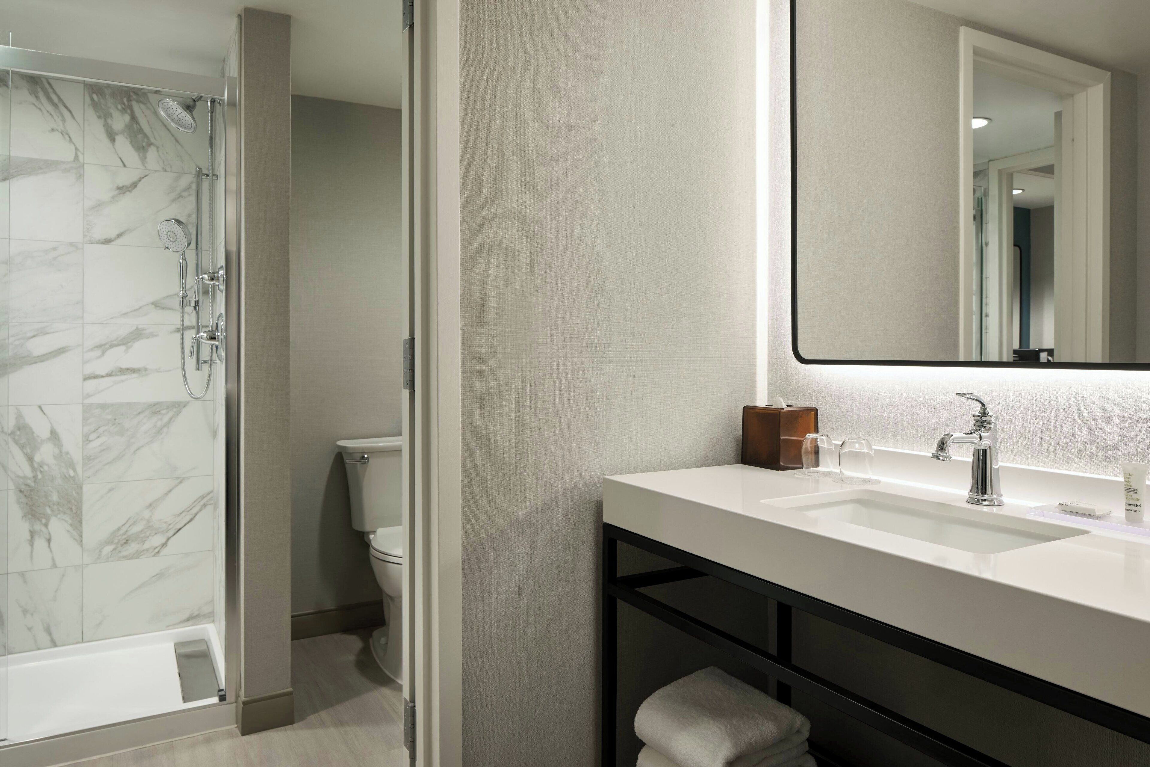 combined shower/bathtub, eco-friendly toiletries, hair dryer, towels