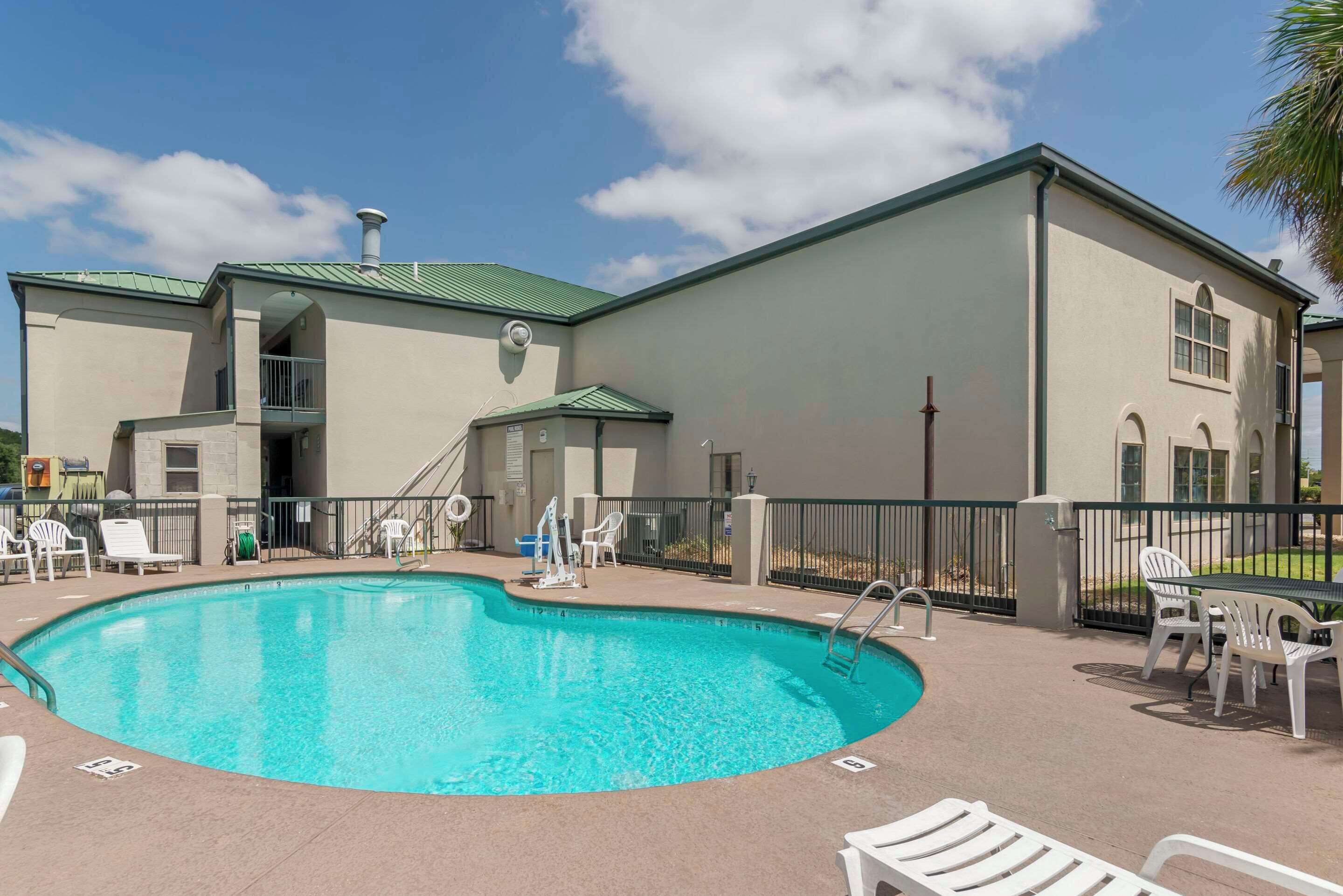 Seasonal outdoor pool, open 10:00 AM to 9:30 PM, pool umbrellas