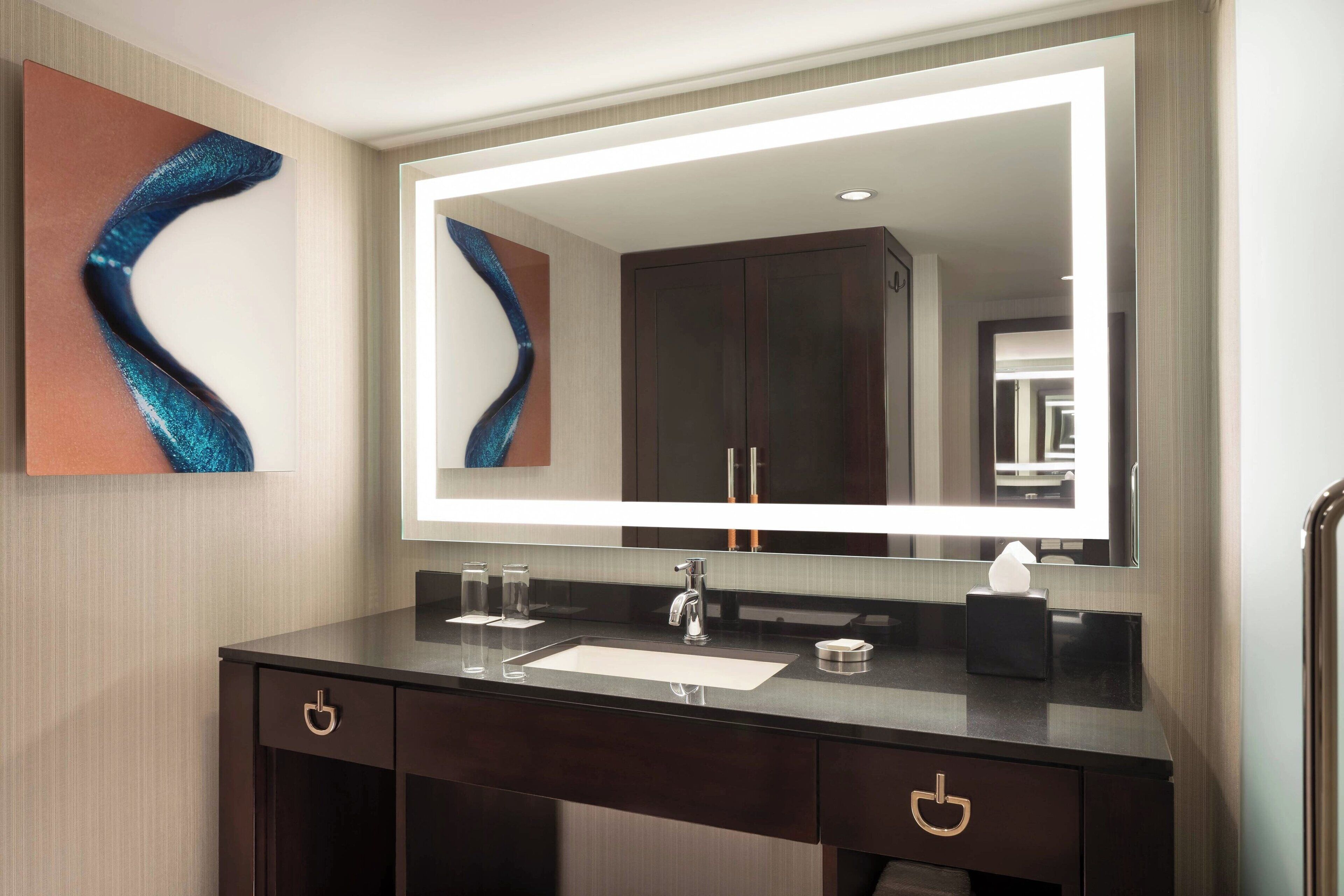 combined shower/bathtub, designer toiletries, hair dryer, towels