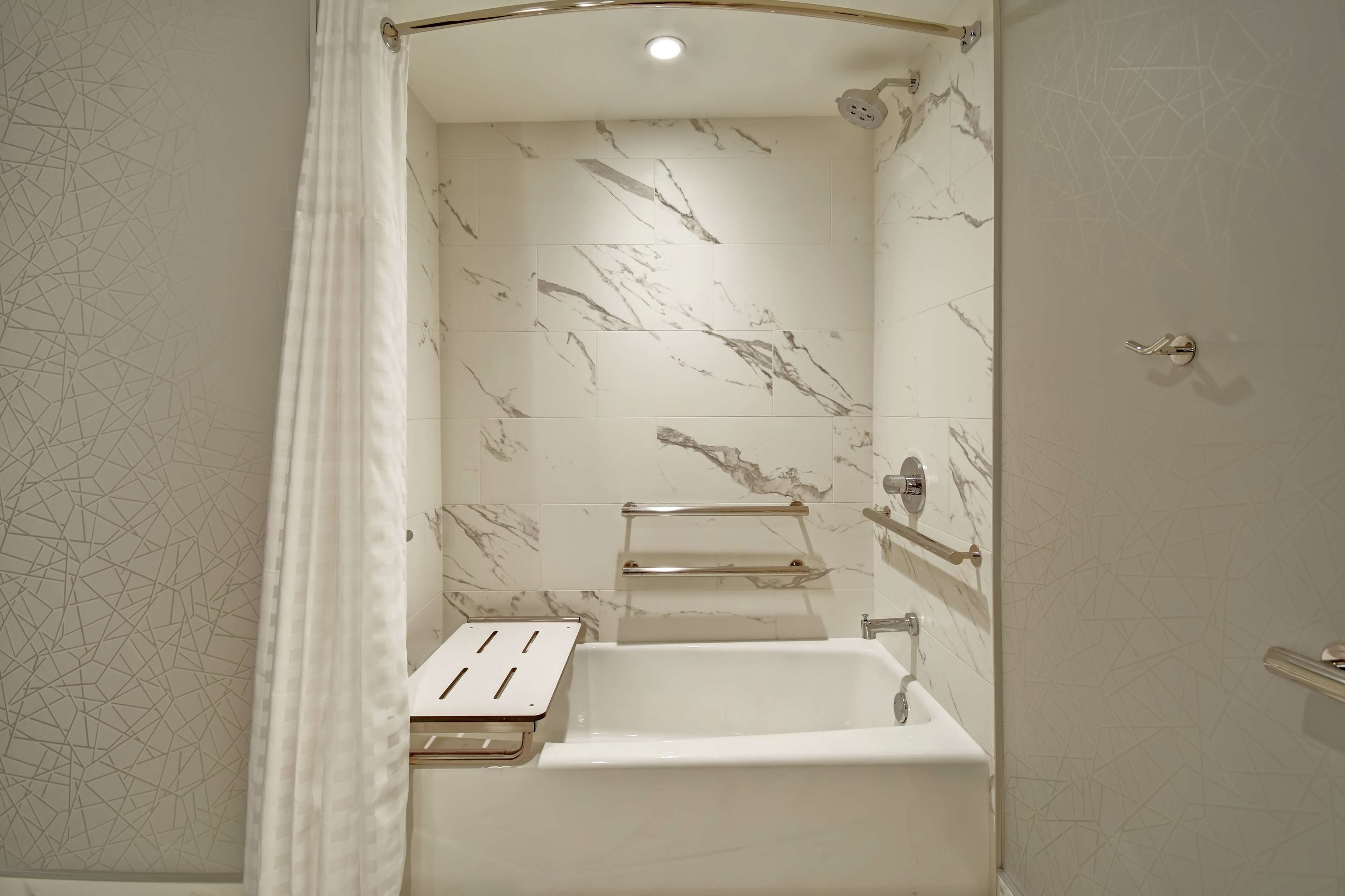 combined shower/bathtub, eco-friendly toiletries, hair dryer, towels