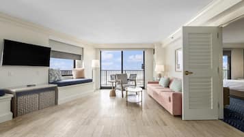 King Ambassador Suite, Suite, 1 King Bed | Living area | 65-inch TV with cable channels