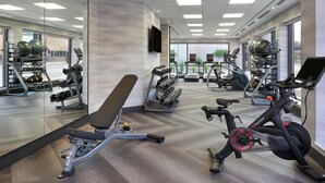 A modern gym with various exercise equipment, large windows, and a clean, spacious layout. - Fairfield by Marriott Niagara Falls, Canada (Niagara Falls)