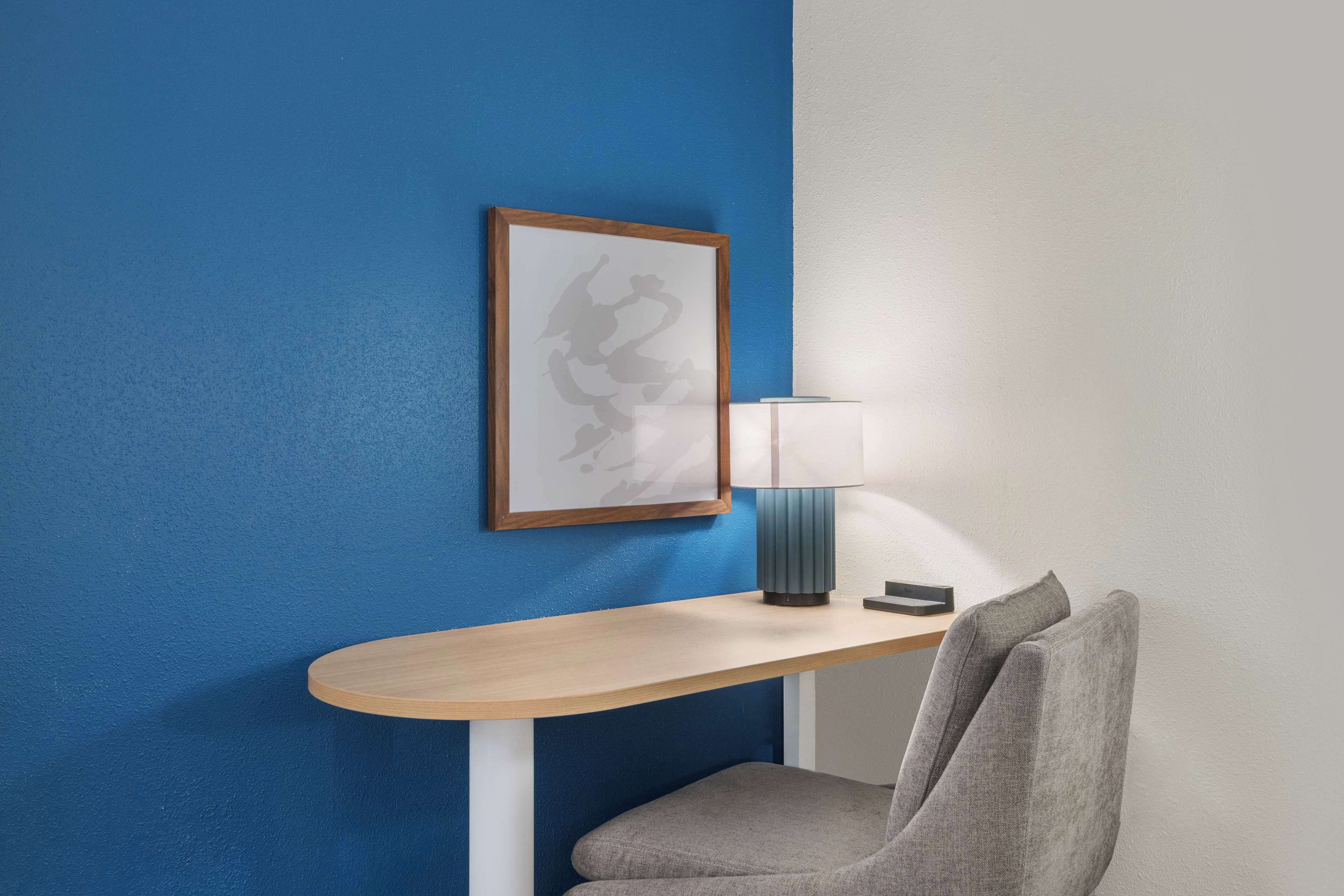 desk, laptop workspace, blackout curtains, iron/ironing board