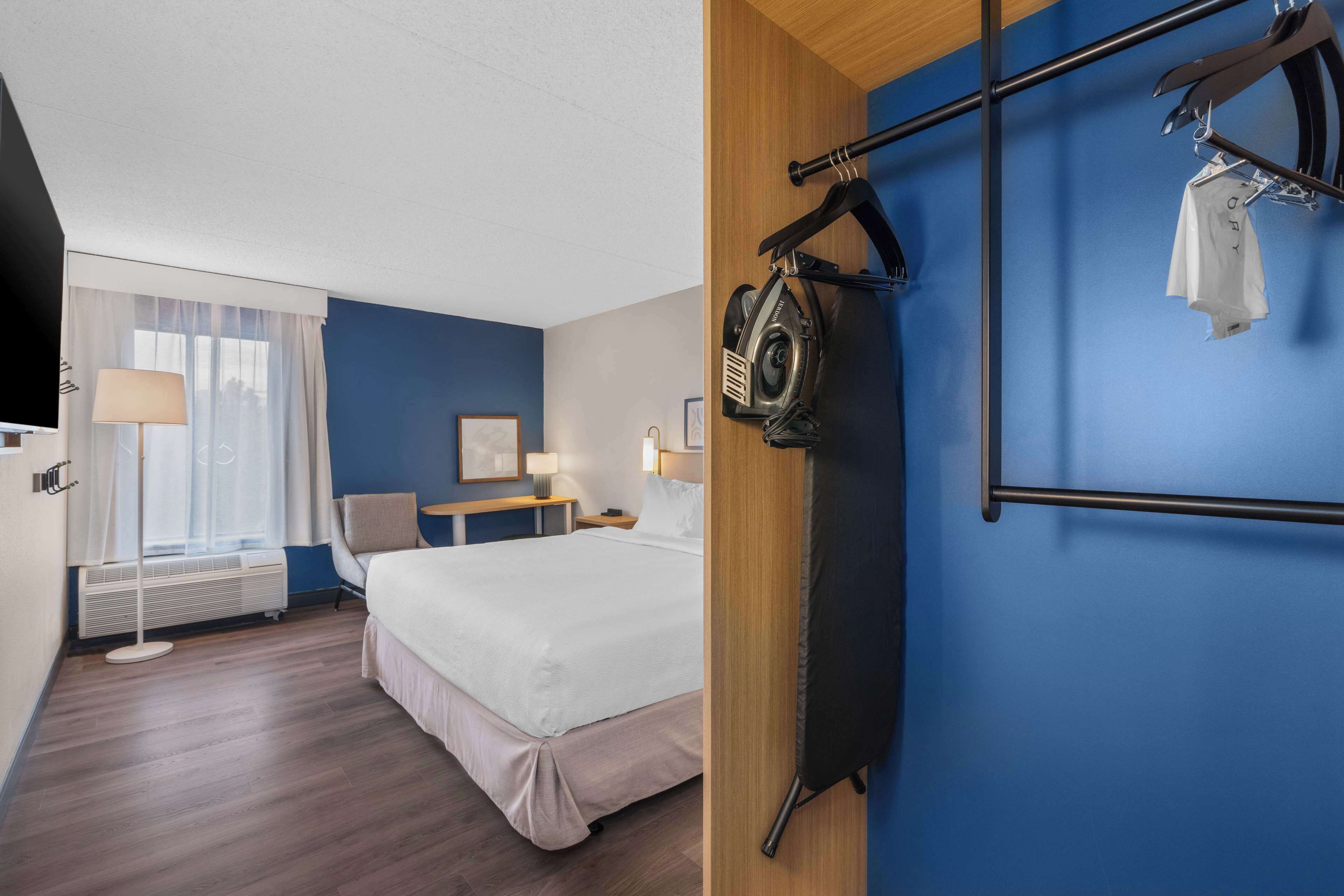 desk, laptop workspace, blackout curtains, iron/ironing board