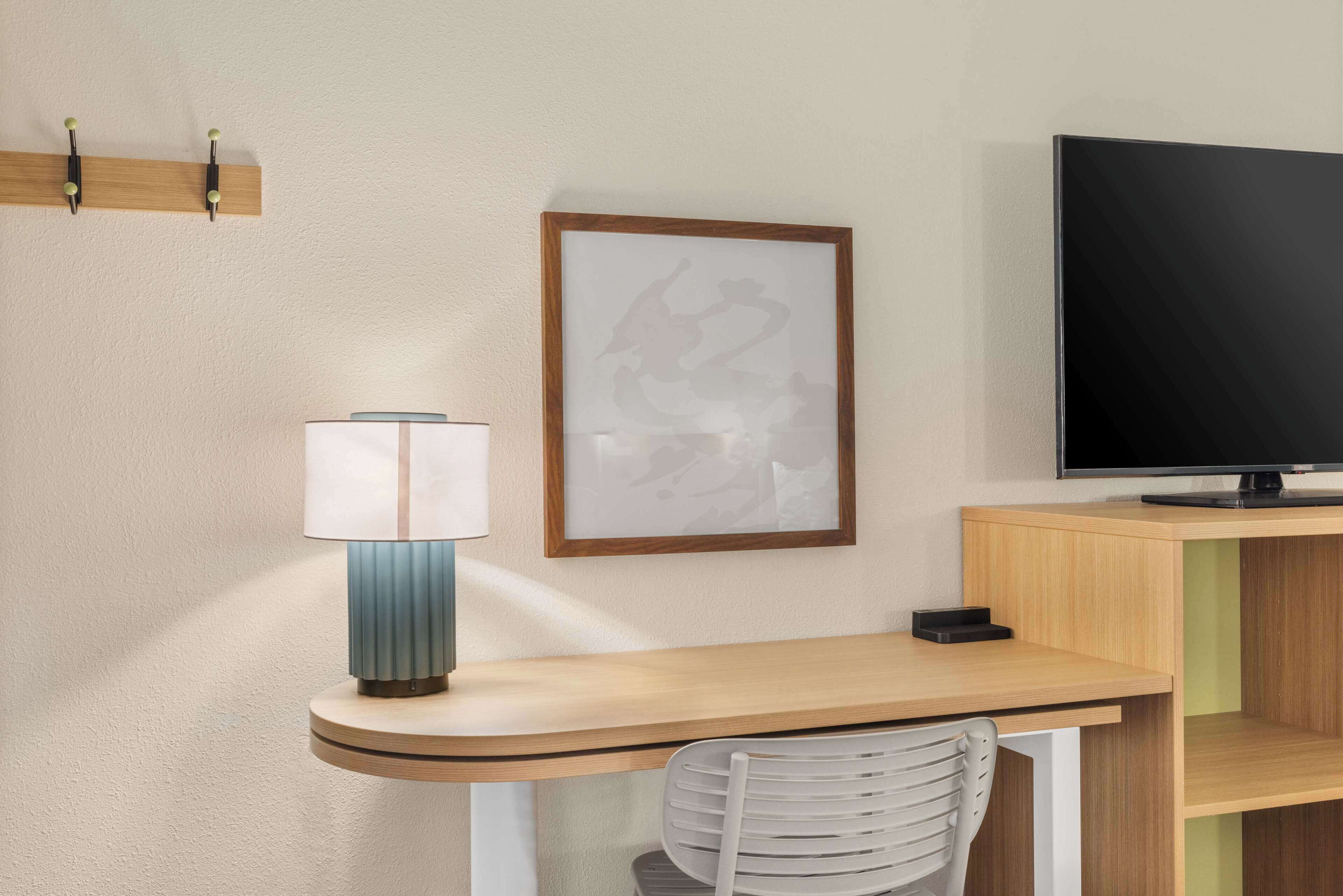 desk, laptop workspace, blackout curtains, iron/ironing board