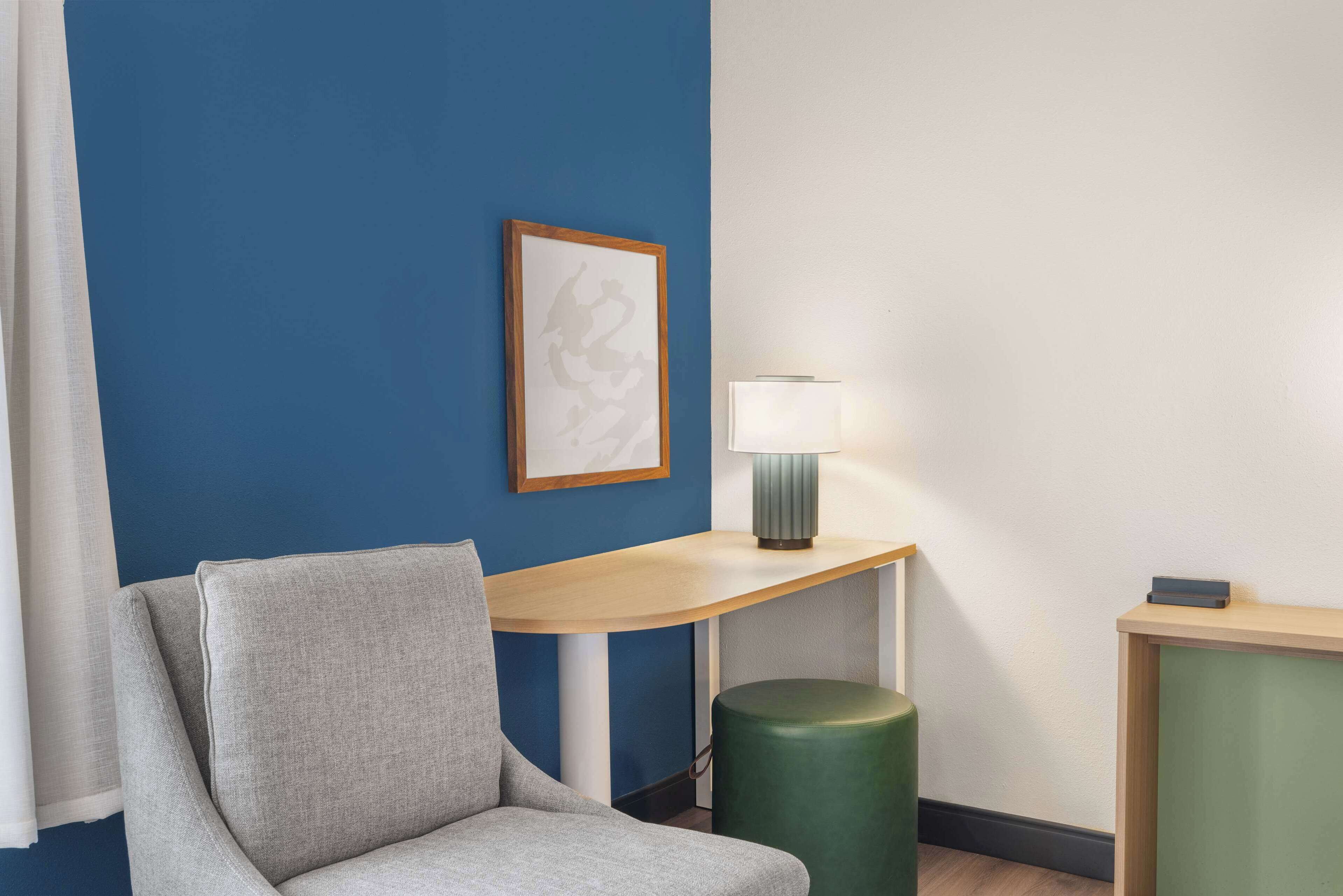 desk, laptop workspace, blackout curtains, iron/ironing board