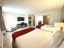 Ropa de cama de alta calidad y caja de seguridad en la habitación 