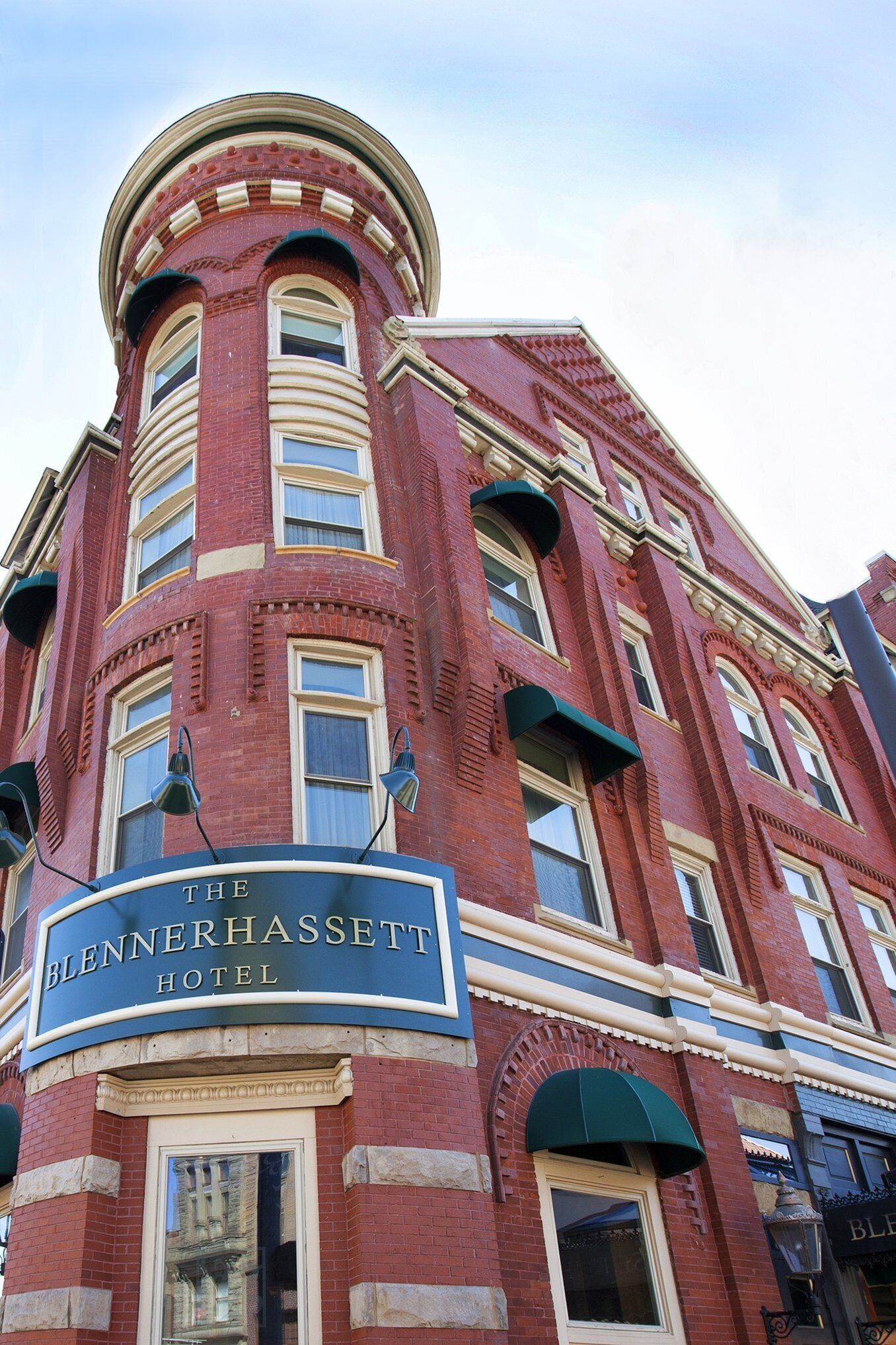 A red brick building with a sign reading "The Blennerhasset Hotel."