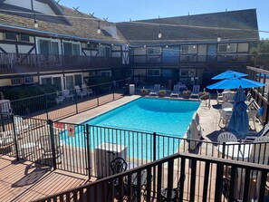 Outdoor pool, open 9:00 AM to 10:00 PM, pool umbrellas, sun loungers