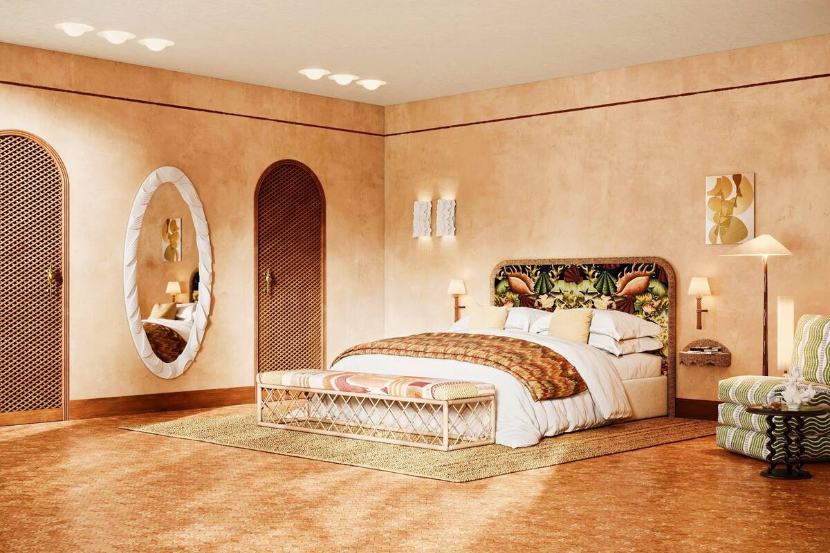 A bedroom with a large bed, a bedside table, a chair, and a mirror.