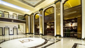 A spacious lobby with a large marble floor, multiple columns, and a grand staircase. - Claridge Hotel (Buenos Aires)