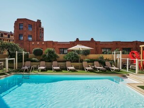 Outdoor pool, open 9:00 AM to 8:00 PM, pool umbrellas, pool loungers