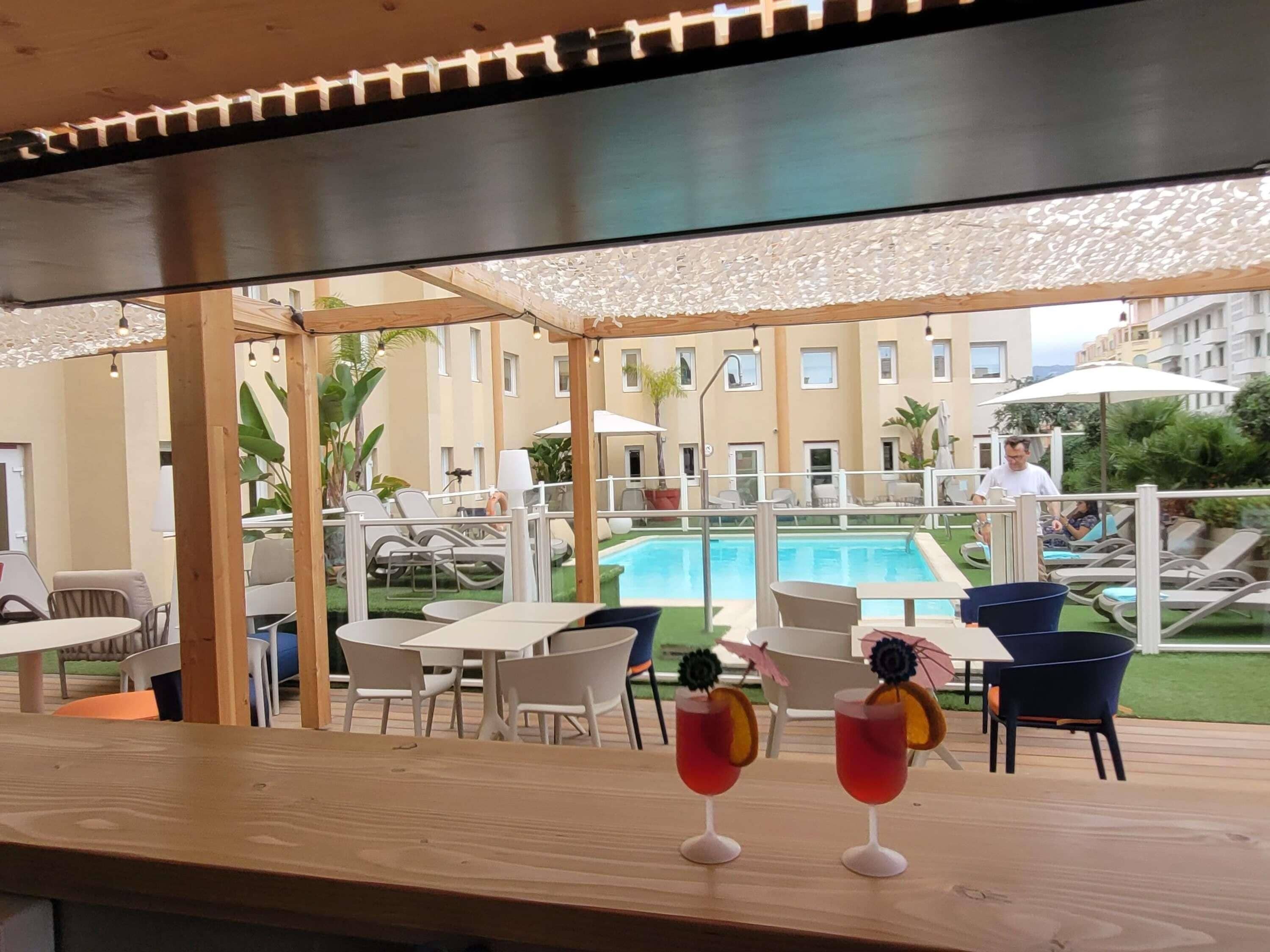 Outdoor pool, open 9:00 AM to 8:00 PM, pool umbrellas, pool loungers