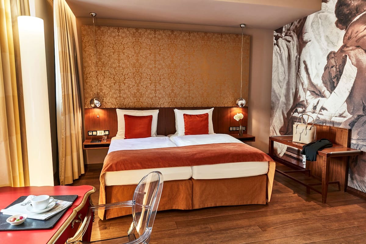 Premium bedding, down comforters, pillowtop beds, minibar