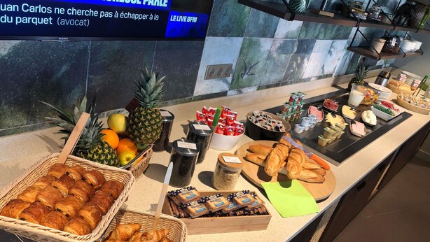 A buffet with various food items including fruits, pastries, and condiments. - ibis Styles Clermont Ferrand Le Brezet Aeroport (Clermont-Ferrand)