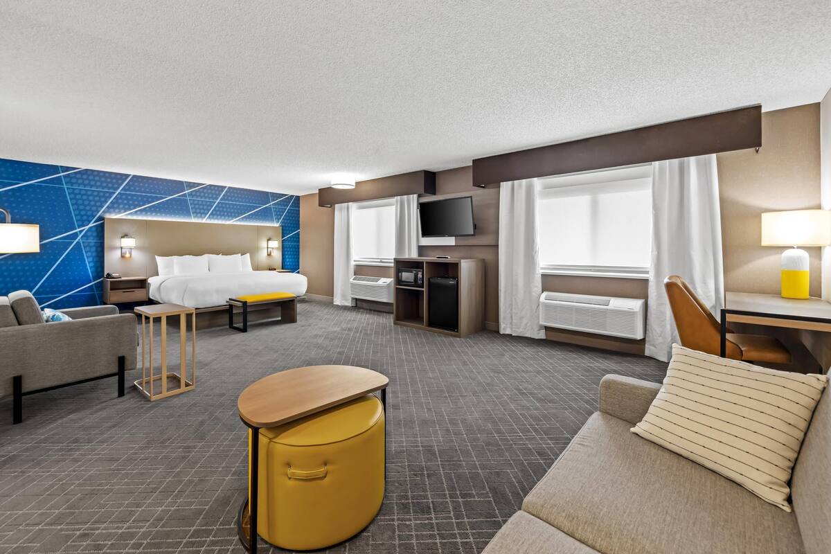 suite, 1 king bed, non smoking | 1 bedroom, desk, laptop workspace, blackout curtains