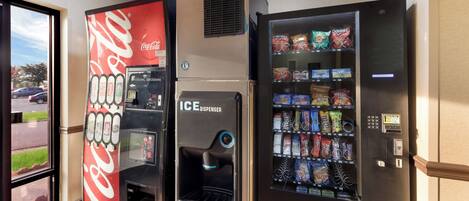 Vending machines with Coca-Cola and ICE dispensers, and a selection of snacks.