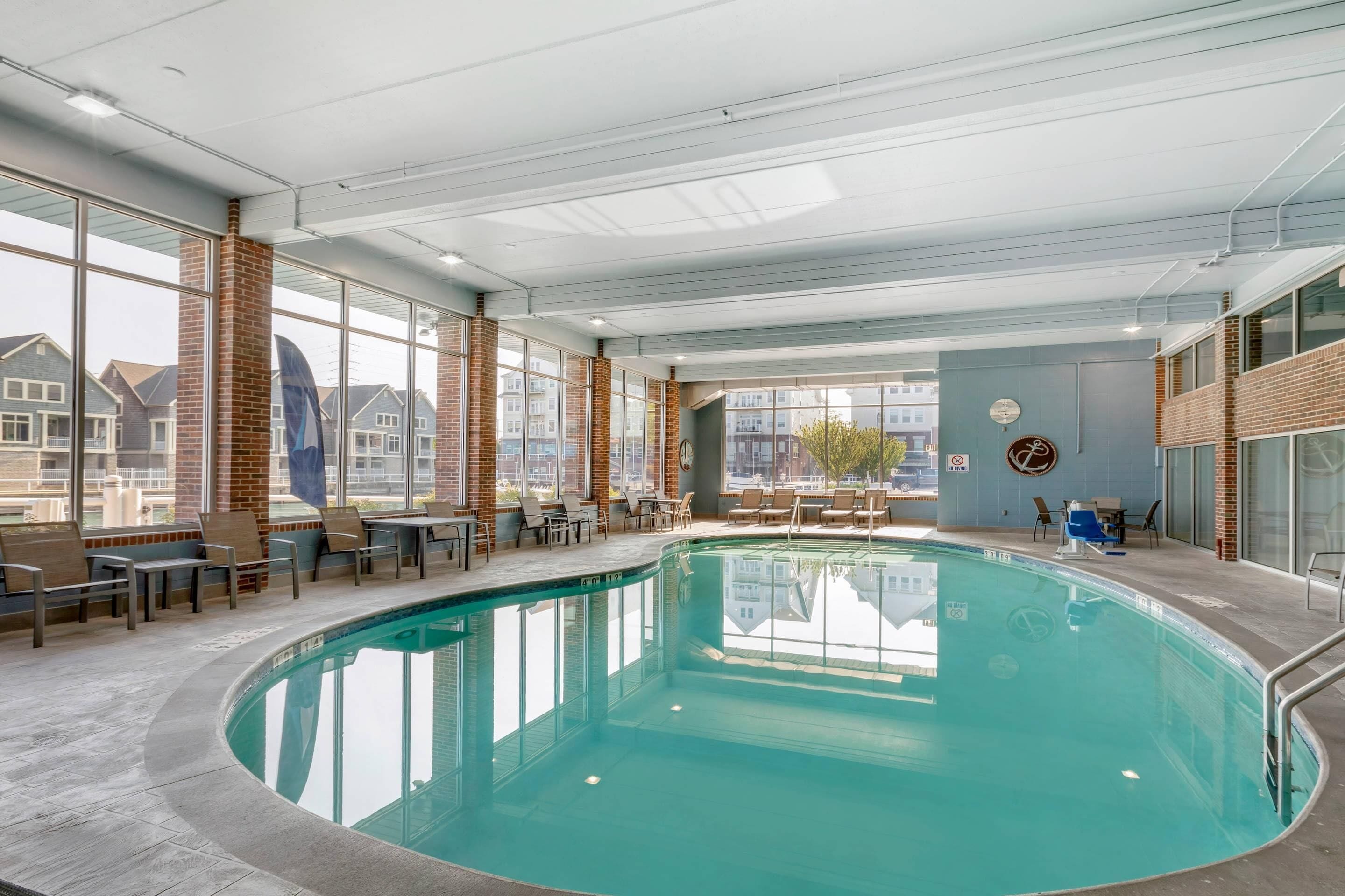 Indoor pool, open 8:00 AM to 10:00 PM, pool loungers