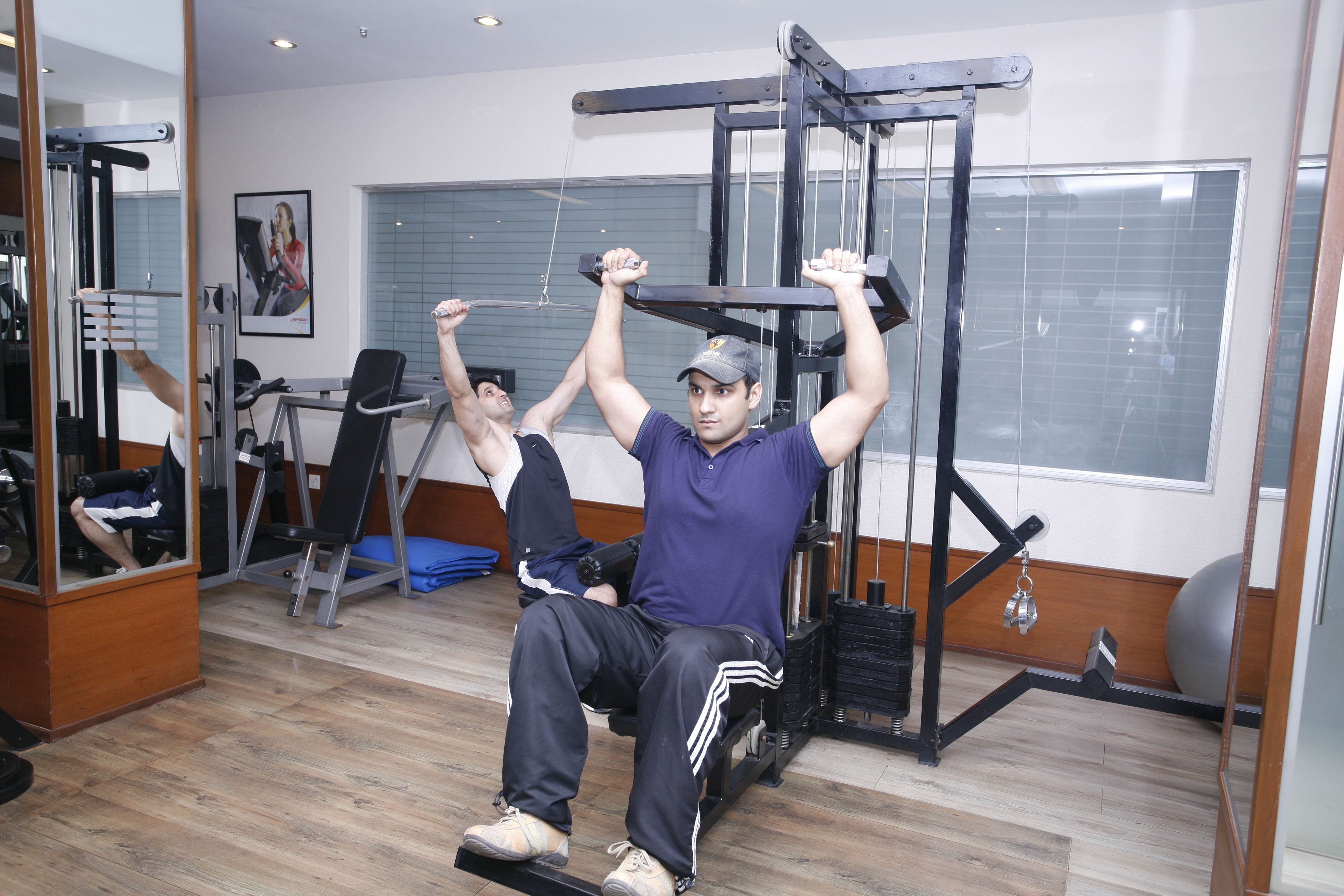 A gym with exercise equipment, including a pull-up bar and weight machines.