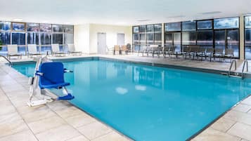 Indoor pool, open 10:00 AM to 10:00 PM, pool loungers
