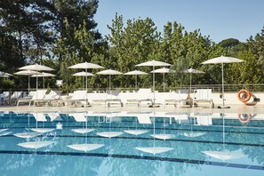 Seasonal outdoor pool, open 8:00 AM to 8:00 PM, pool umbrellas