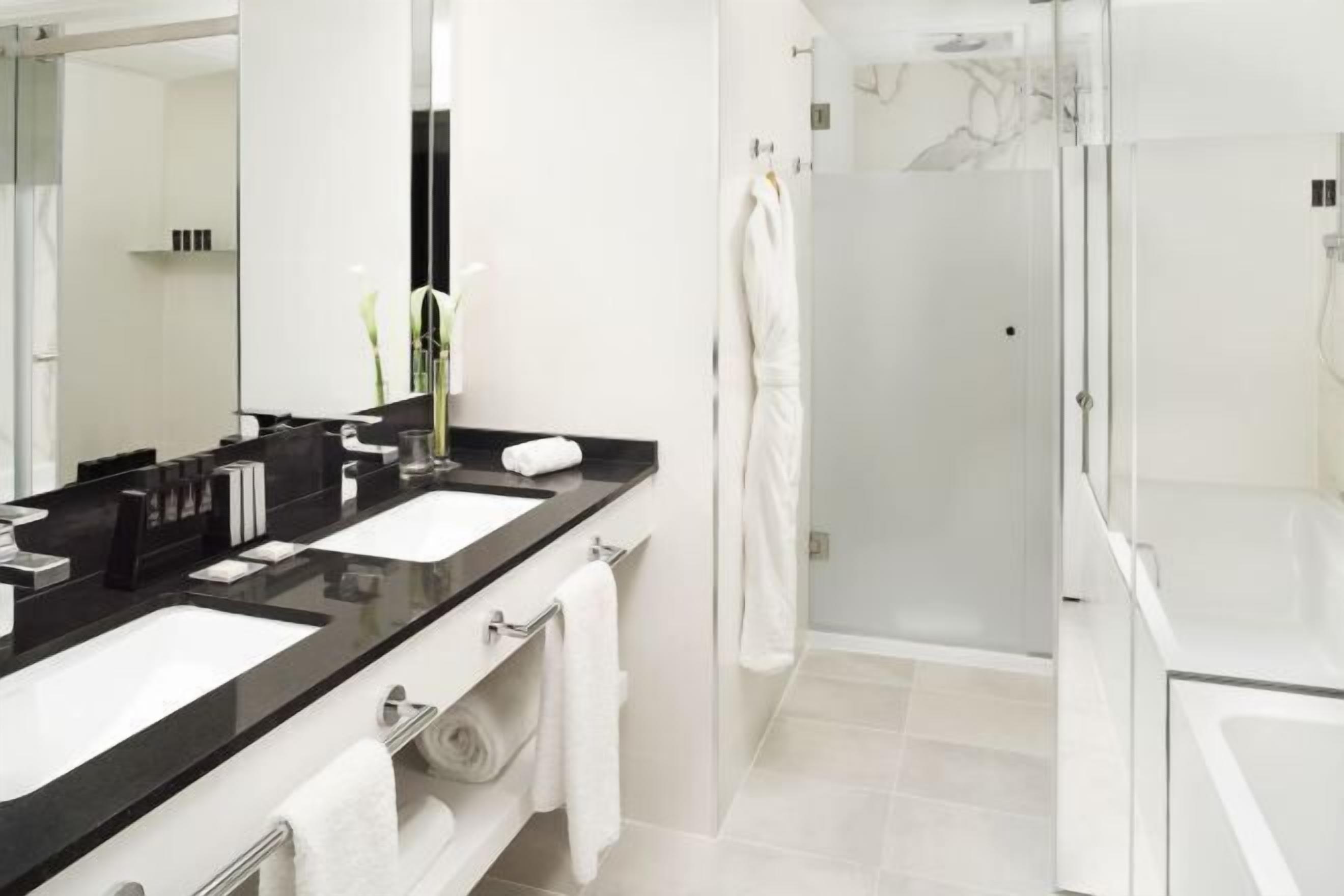 Designer toiletries, hair dryer, towels